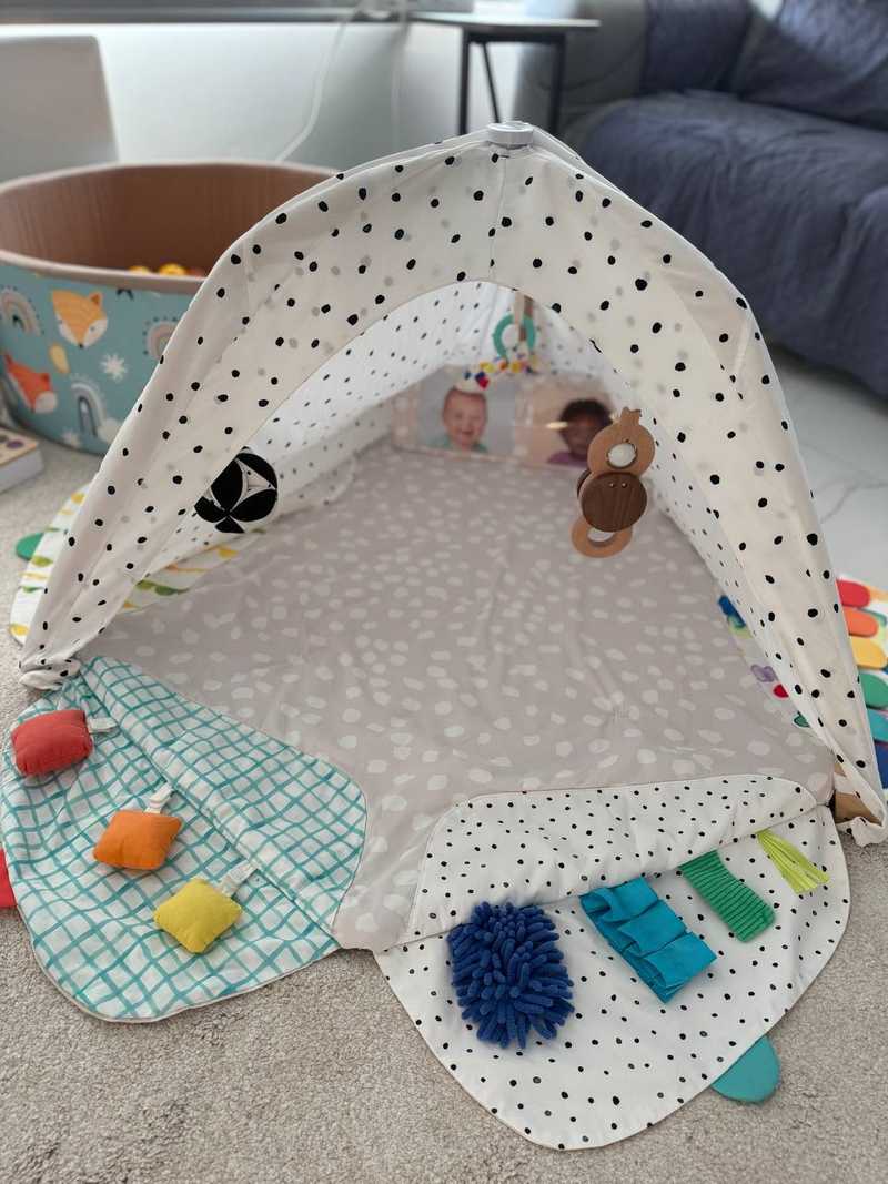 Lovevery stage-based developmental activity gym play mat for