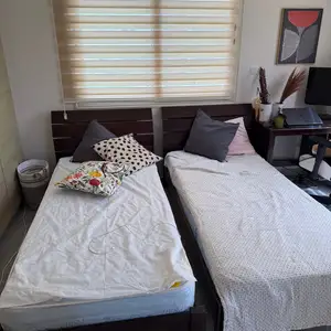 Wooden single beds with mattresses, Paphos — Tombs Of the Kings