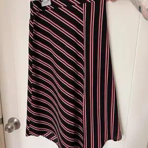 Asymmetrical black skirt with red and white stripes, Limassol — Germasogeia