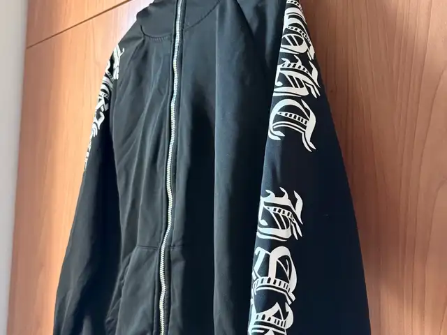 Full zip hoodie with bold gothic lettering running down the length of sleeves, Nicosia — Latsia - Agios Georgios