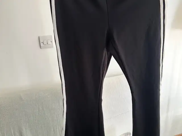 Black pants with white stripes on the side, Nicosia — Aglantzia