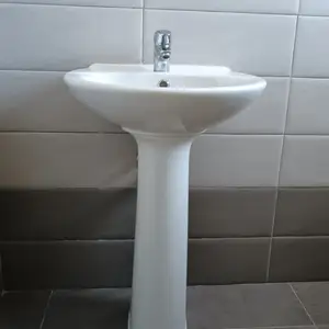 Ceramic pedestal wash basin with a single-hole chrome faucet, Paphos — Tala