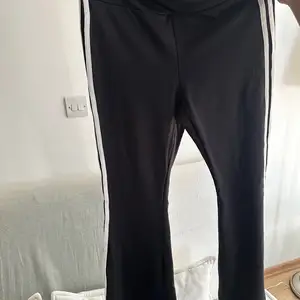 Black pants with white stripes on the side, Nicosia — Aglantzia