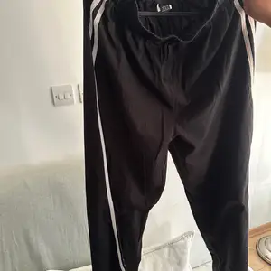 Black pants with white stripes, Nicosia — Aglantzia